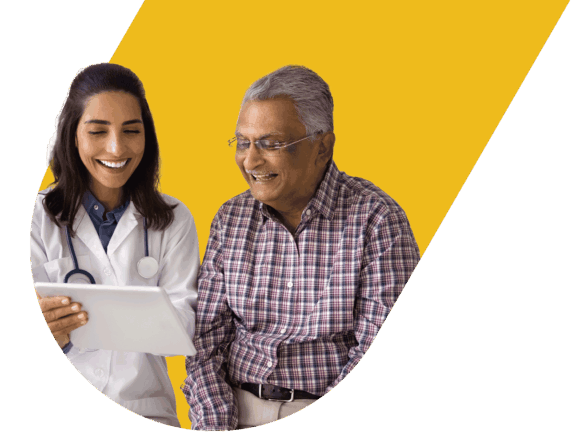 Young female doctor showing senior male patient test results on tablet