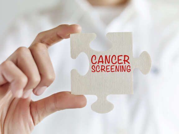 Puzzle Piece with Cancer Screening Written on It