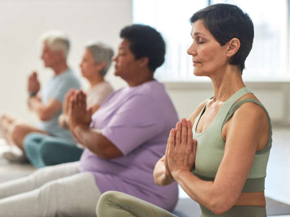 People calmly meditating, relieving stress